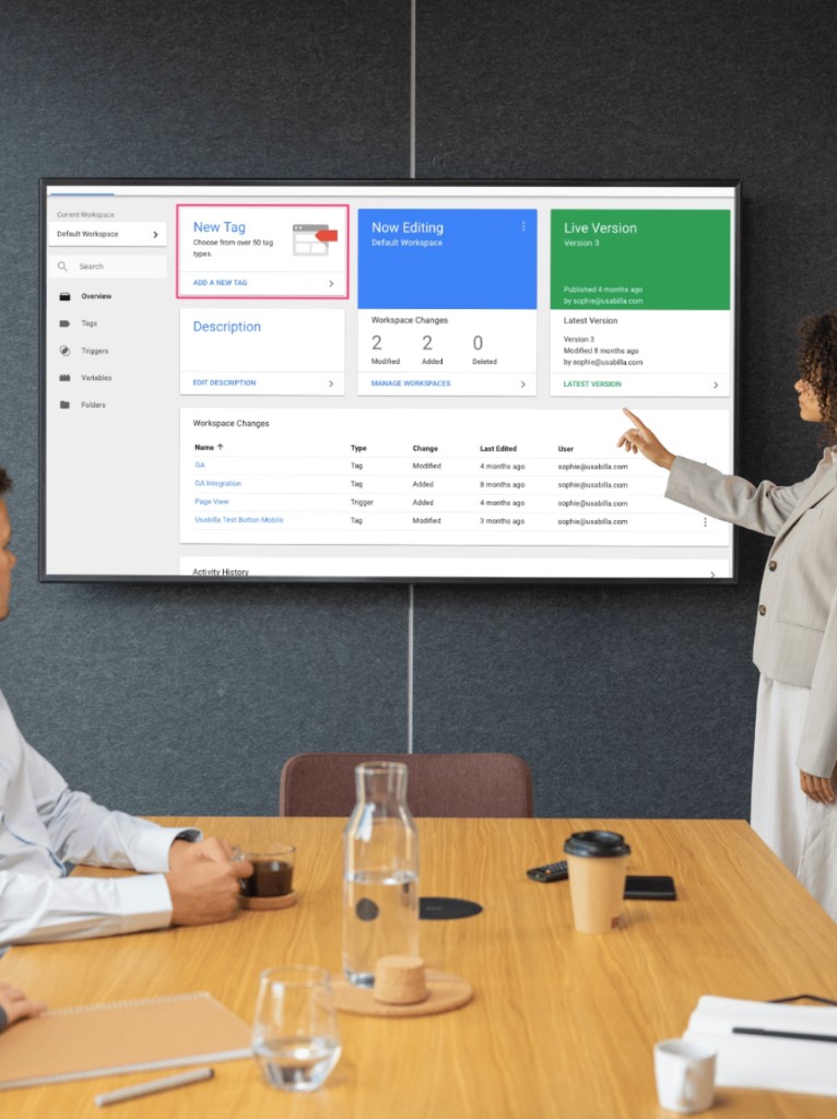 Marketing team configuring analytics and conversion tracking on a presentation screen